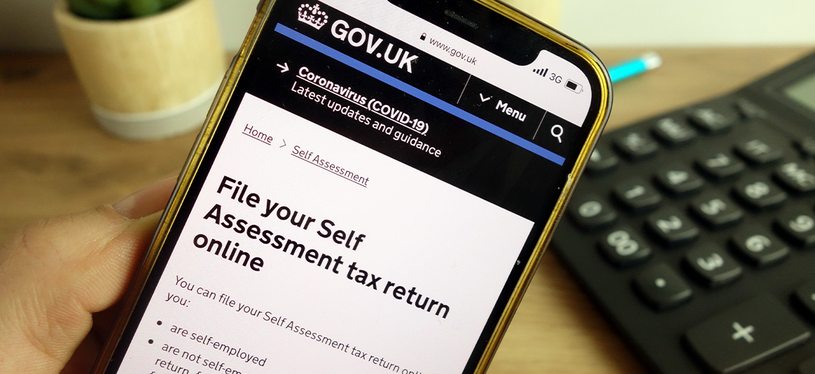 Image on a phone highlighting self assessment options on gov.uk